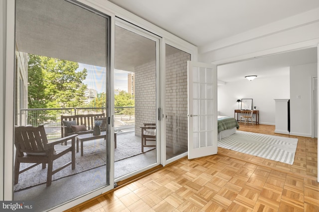 entryway featuring light parquet flooring and french doors