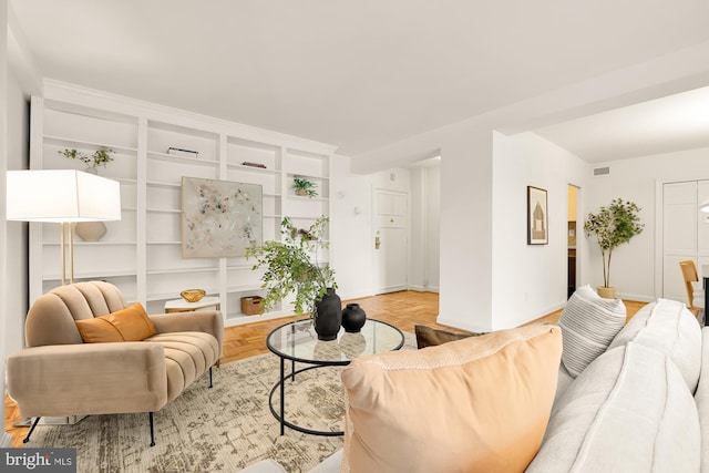 living room featuring parquet floors