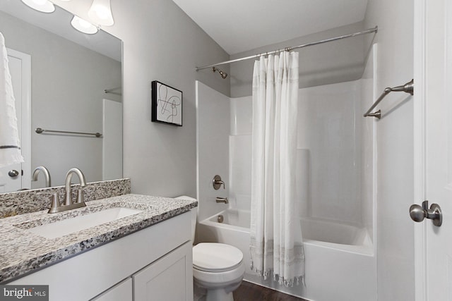 full bathroom with hardwood / wood-style floors, vanity, toilet, and shower / bath combo