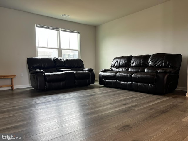 living room with dark hardwood / wood-style floors