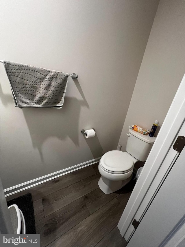 bathroom featuring toilet and hardwood / wood-style flooring