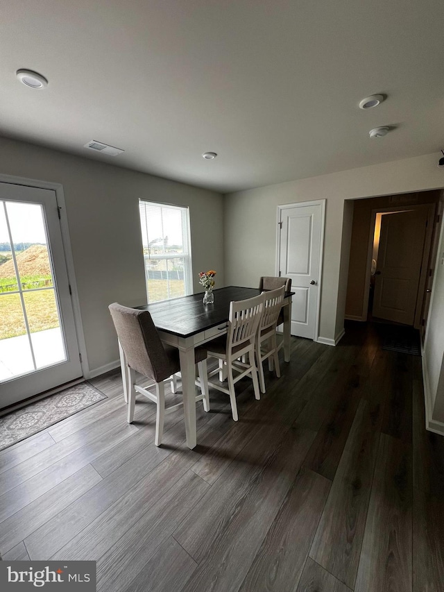 dining area featuring dark hardwood / wood-style floors