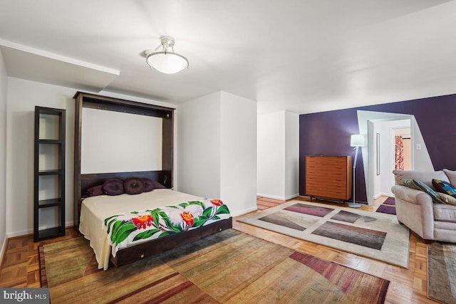 bedroom with parquet flooring