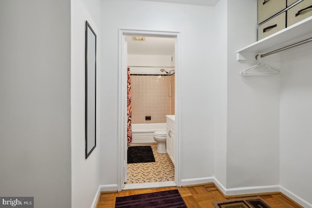 full bathroom with shower / bath combination with curtain, toilet, and vanity