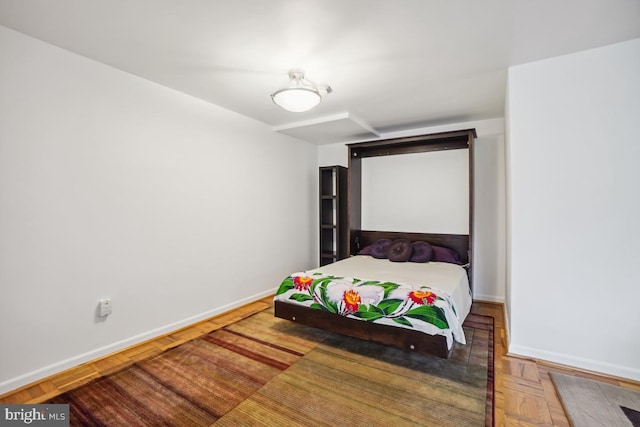 bedroom featuring parquet floors