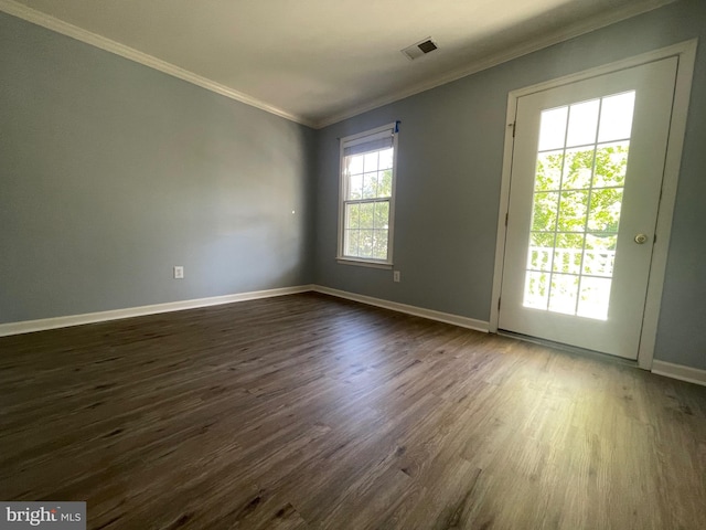 unfurnished room with dark wood-type flooring and ornamental molding