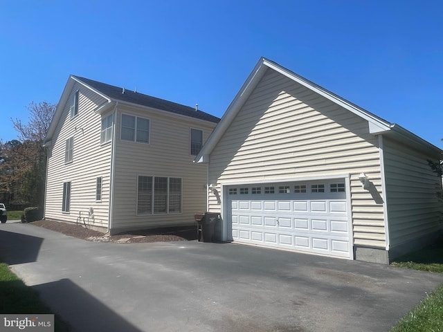 view of property exterior with a garage