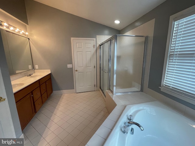 bathroom featuring tile patterned flooring, vanity, independent shower and bath, and vaulted ceiling