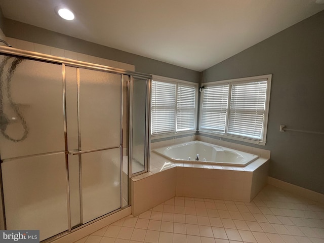 bathroom featuring tile patterned floors, vaulted ceiling, and shower with separate bathtub