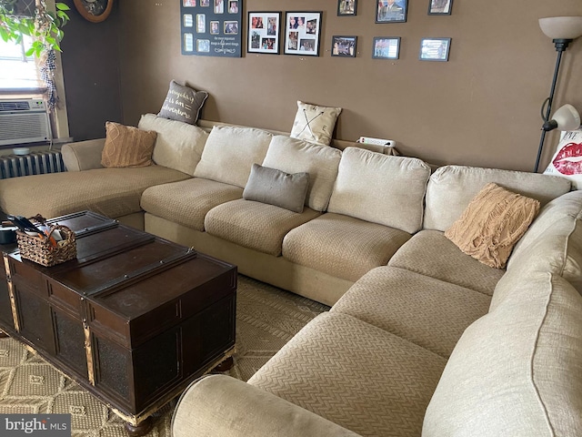 carpeted living room featuring radiator