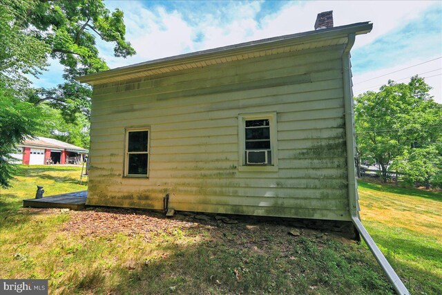 view of property exterior featuring a yard