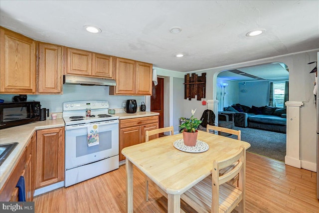 kitchen with electric range and light wood-type flooring