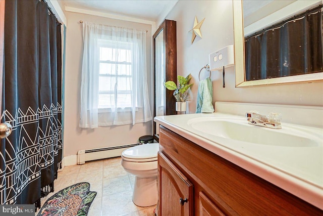 bathroom with baseboard heating, tile patterned flooring, vanity, and toilet