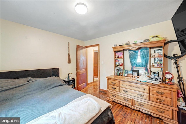 bedroom with light hardwood / wood-style flooring