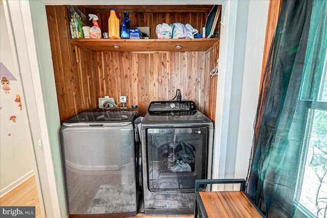 laundry area with washing machine and clothes dryer