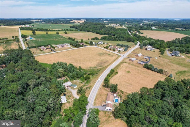 birds eye view of property with a rural view