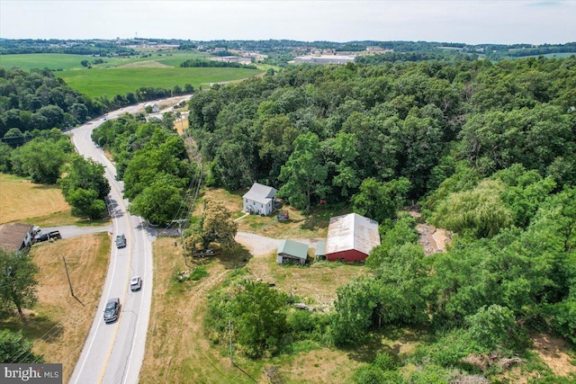 birds eye view of property with a rural view