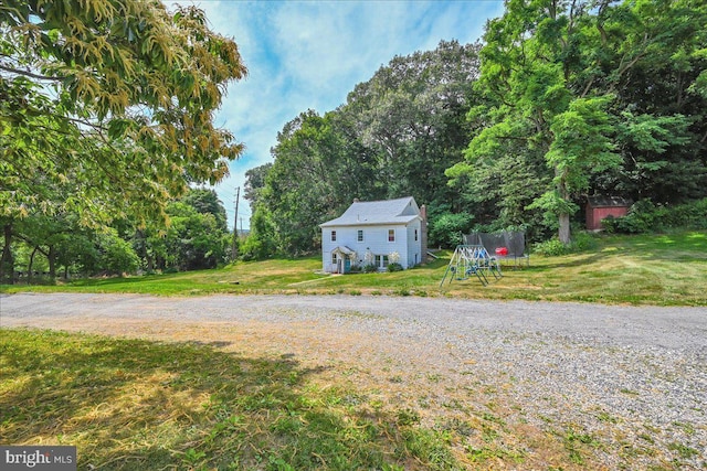 view of yard with a trampoline