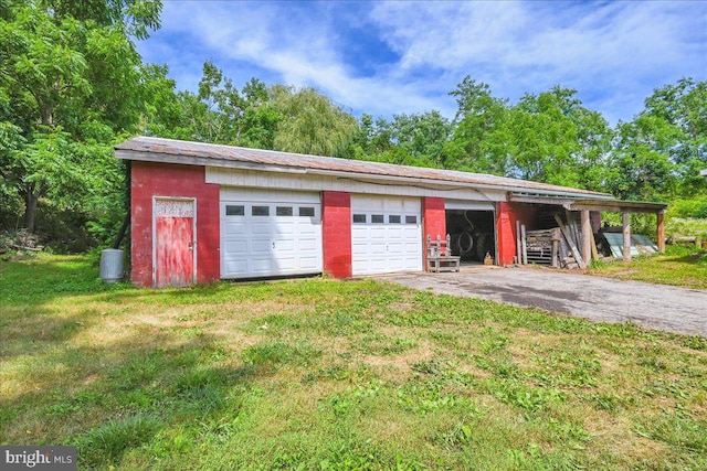 garage featuring a yard