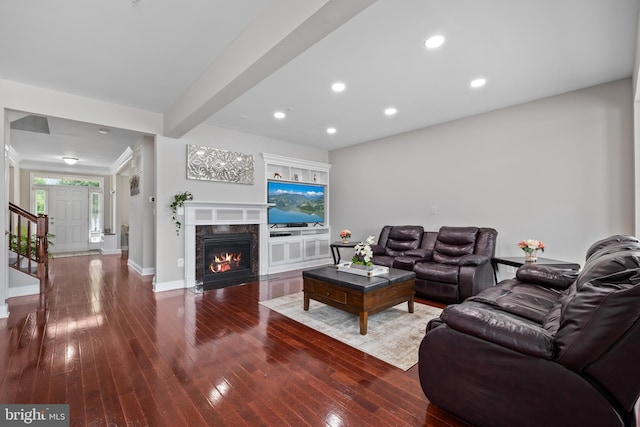 living room with recessed lighting, dark wood-style flooring, baseboards, stairs, and beam ceiling