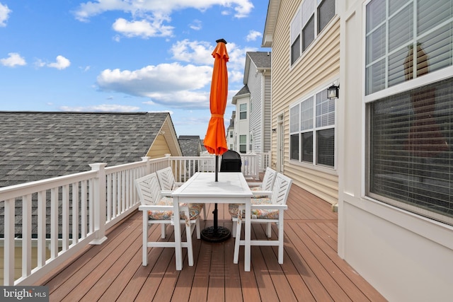 wooden deck featuring outdoor dining space