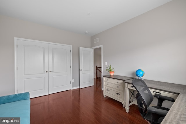 office space featuring dark wood-style flooring and visible vents