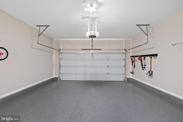 garage with a garage door opener and baseboards