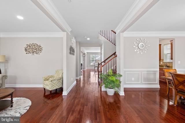 foyer entrance with baseboards, stairway, ornamental molding, dark wood-style flooring, and recessed lighting