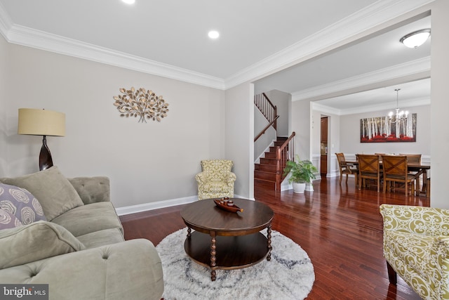 living area featuring a chandelier, baseboards, ornamental molding, stairway, and dark wood finished floors