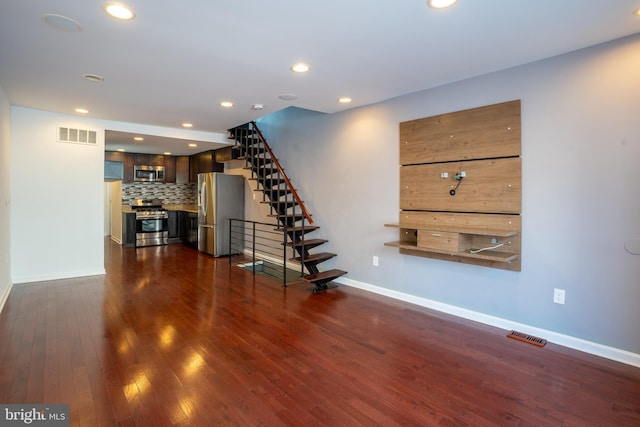 unfurnished living room with dark hardwood / wood-style floors