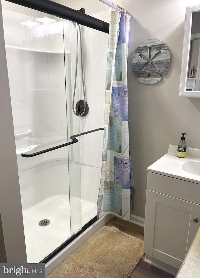 bathroom featuring vanity and a shower with shower curtain