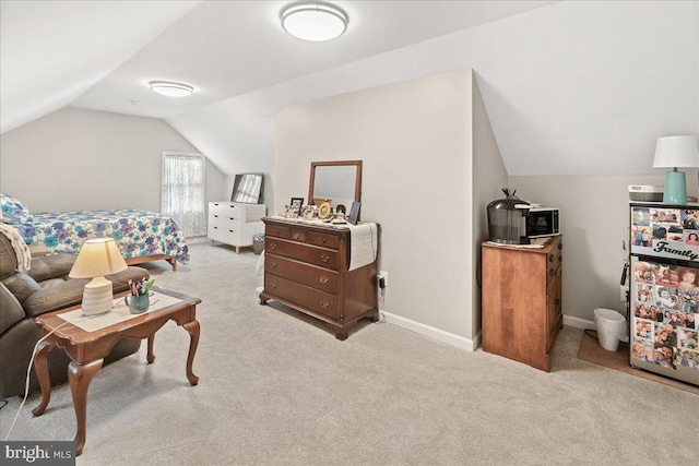 carpeted bedroom featuring lofted ceiling