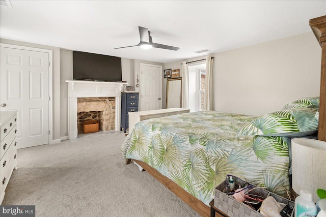 bedroom with light carpet and ceiling fan