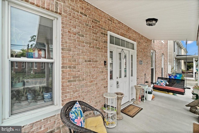 property entrance featuring covered porch