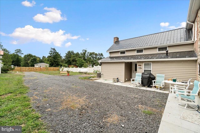 exterior space featuring central AC and a patio