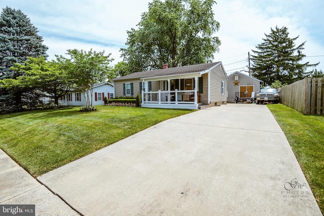 view of front facade with covered porch and a front lawn