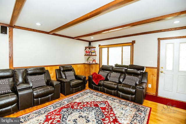 living room featuring hardwood / wood-style floors and beamed ceiling