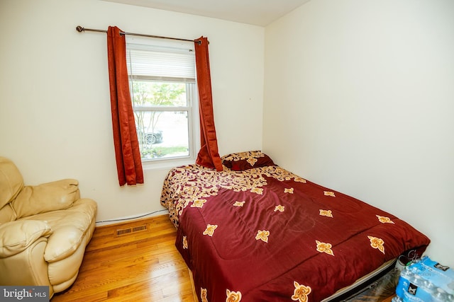 bedroom with light wood-type flooring