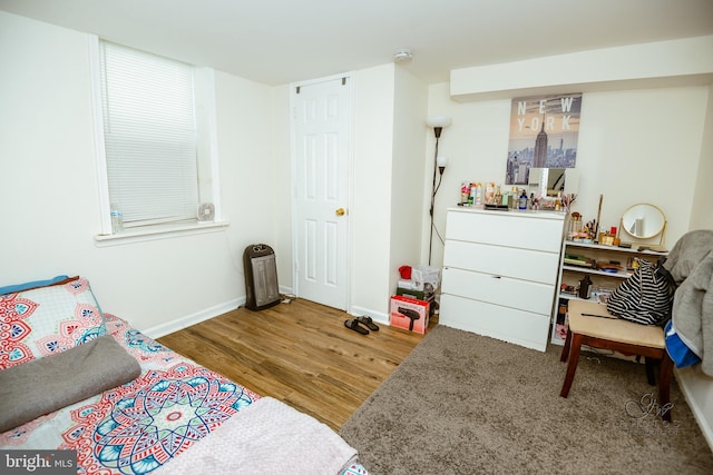 bedroom featuring wood-type flooring