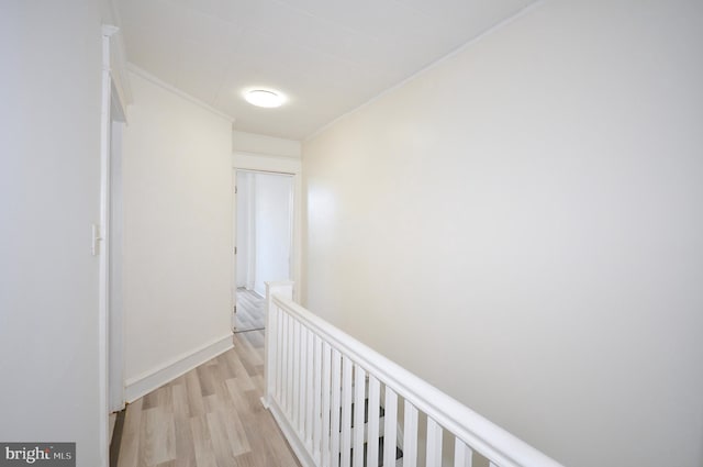 corridor with light hardwood / wood-style flooring