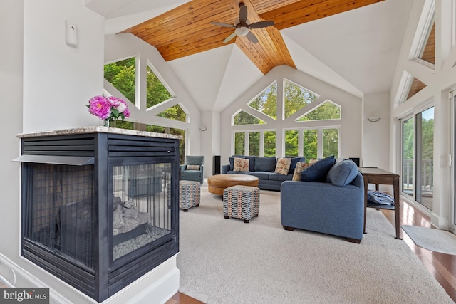 living room featuring ceiling fan, wood-type flooring, wooden ceiling, and high vaulted ceiling