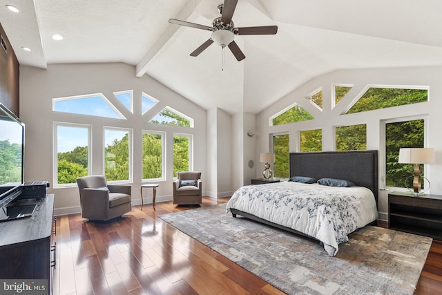 bedroom featuring ceiling fan, dark wood-type flooring, and vaulted ceiling