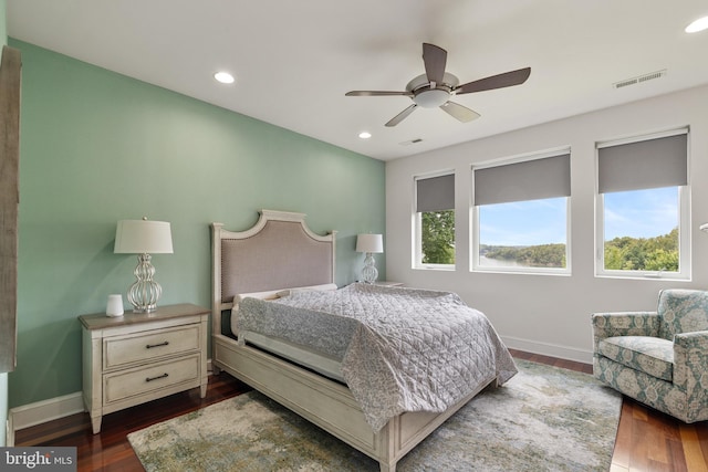 bedroom featuring dark hardwood / wood-style flooring and ceiling fan