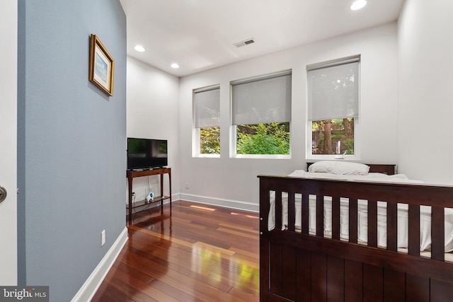 bedroom featuring dark hardwood / wood-style floors