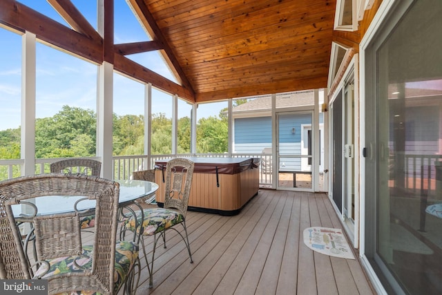 sunroom / solarium with wooden ceiling and vaulted ceiling