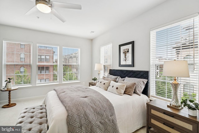 bedroom featuring ceiling fan and carpet