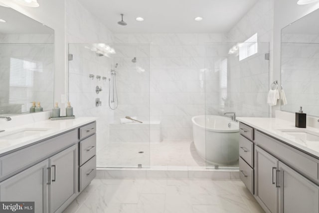 bathroom with vanity, tile walls, and plus walk in shower