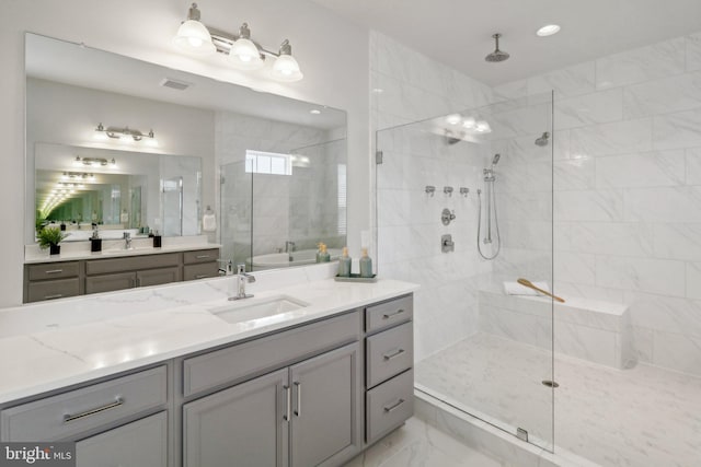 bathroom with separate shower and tub and vanity