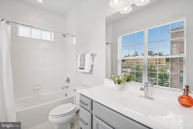 full bathroom featuring vanity, toilet, and shower / bath combo with shower curtain