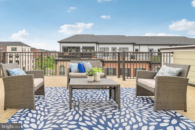 wooden terrace with an outdoor living space